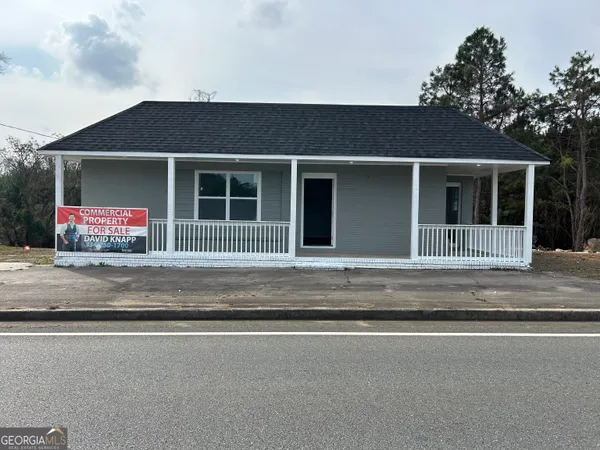 a front view of a house with a outdoor space
