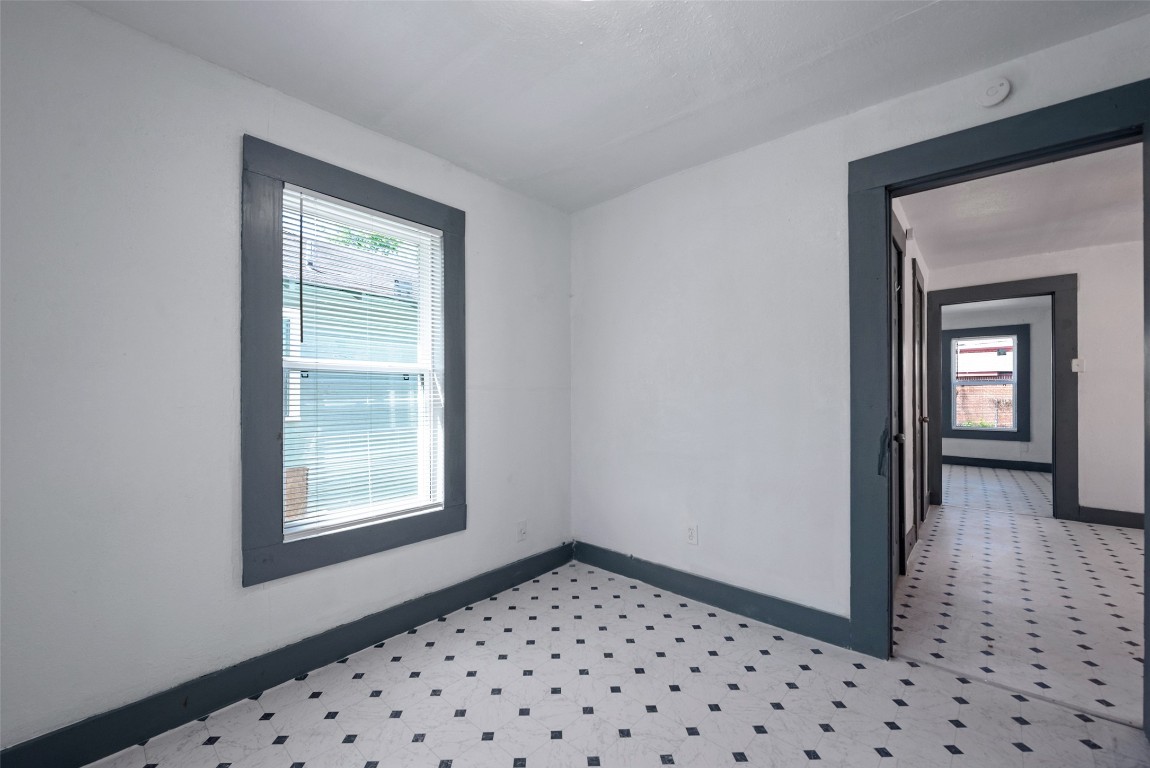 2217 Stevens Street Houston, TX 77026 - Photo 13 of 19 a bedroom with a bed and a window