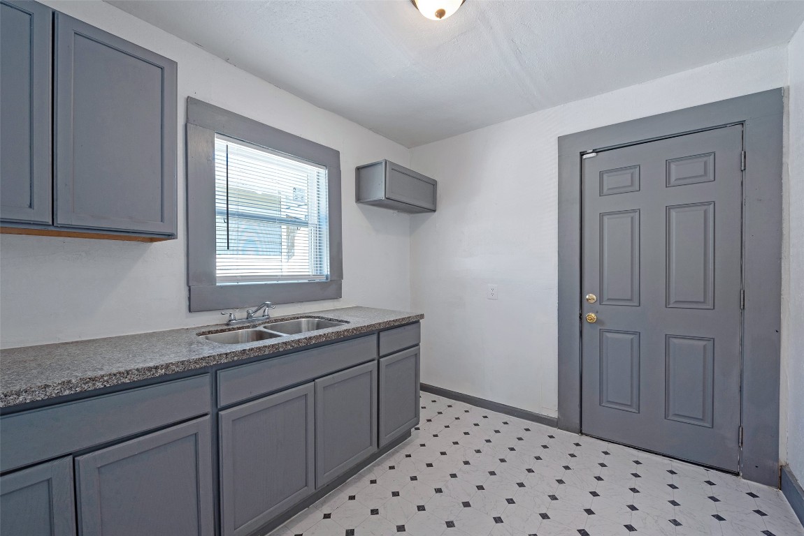 2217 Stevens Street Houston, TX 77026 - Photo 17 of 19 a bathroom with a sink a vanity and a window