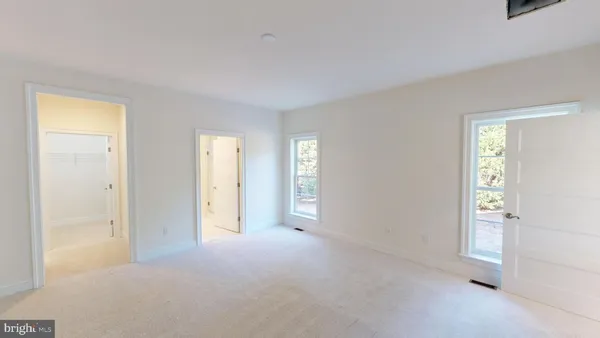 a view of empty room with windows