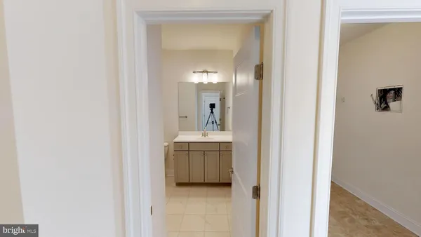 a view of a bathroom from a hallway