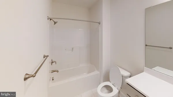 a bathroom with a bathtub and a toilet