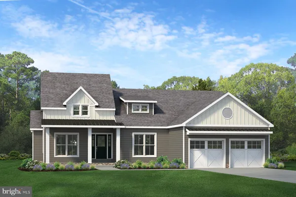 a view of house with yard and green space