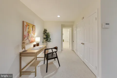 a workspace with furniture and window