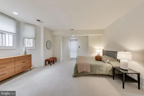 a bedroom with bed and window