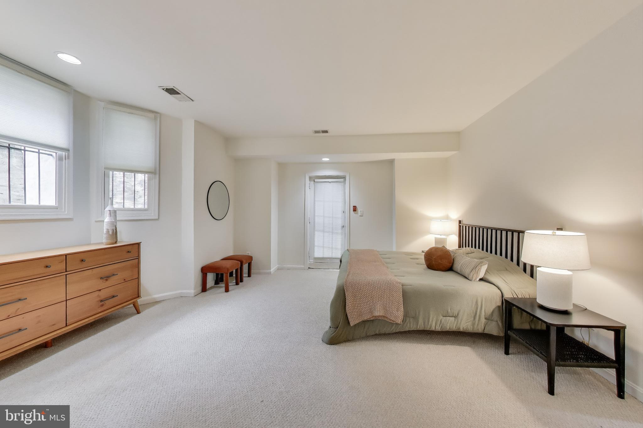 2001 19th Street Northwest, Unit 3 Washington, DC 20009 - Photo 13 of 29 a bedroom with bed and window
