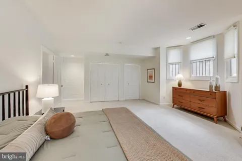 a bedroom with a bed and a cabinets