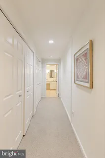 a view of a hallway with an entryway