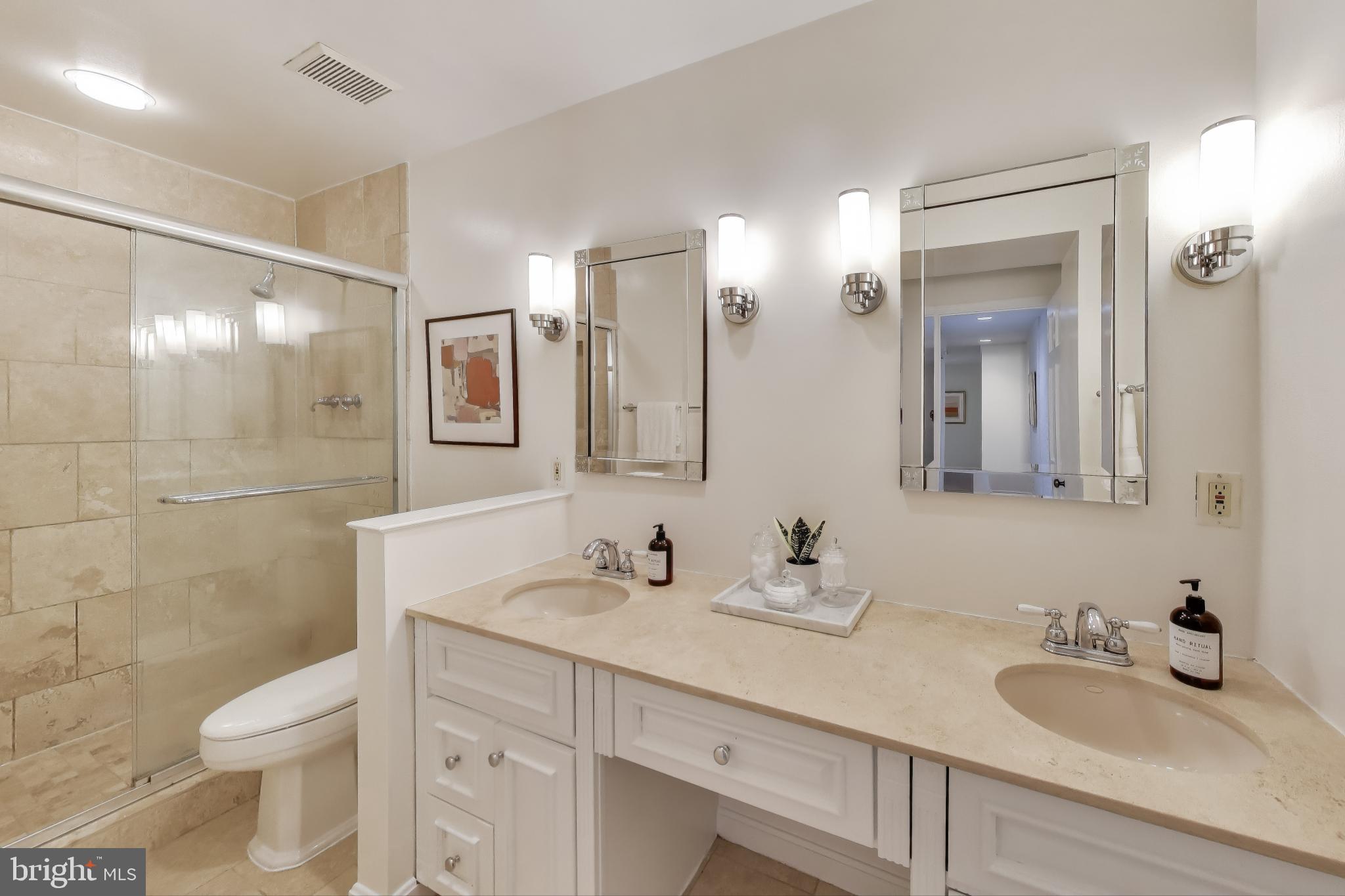 2001 19th Street Northwest, Unit 3 Washington, DC 20009 - Photo 17 of 29 a bathroom with a sink double vanity and a toilet