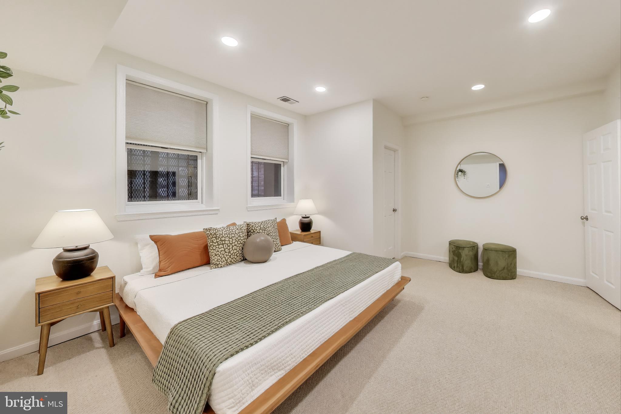 2001 19th Street Northwest, Unit 3 Washington, DC 20009 - Photo 18 of 29 a bedroom with a bed and lamp