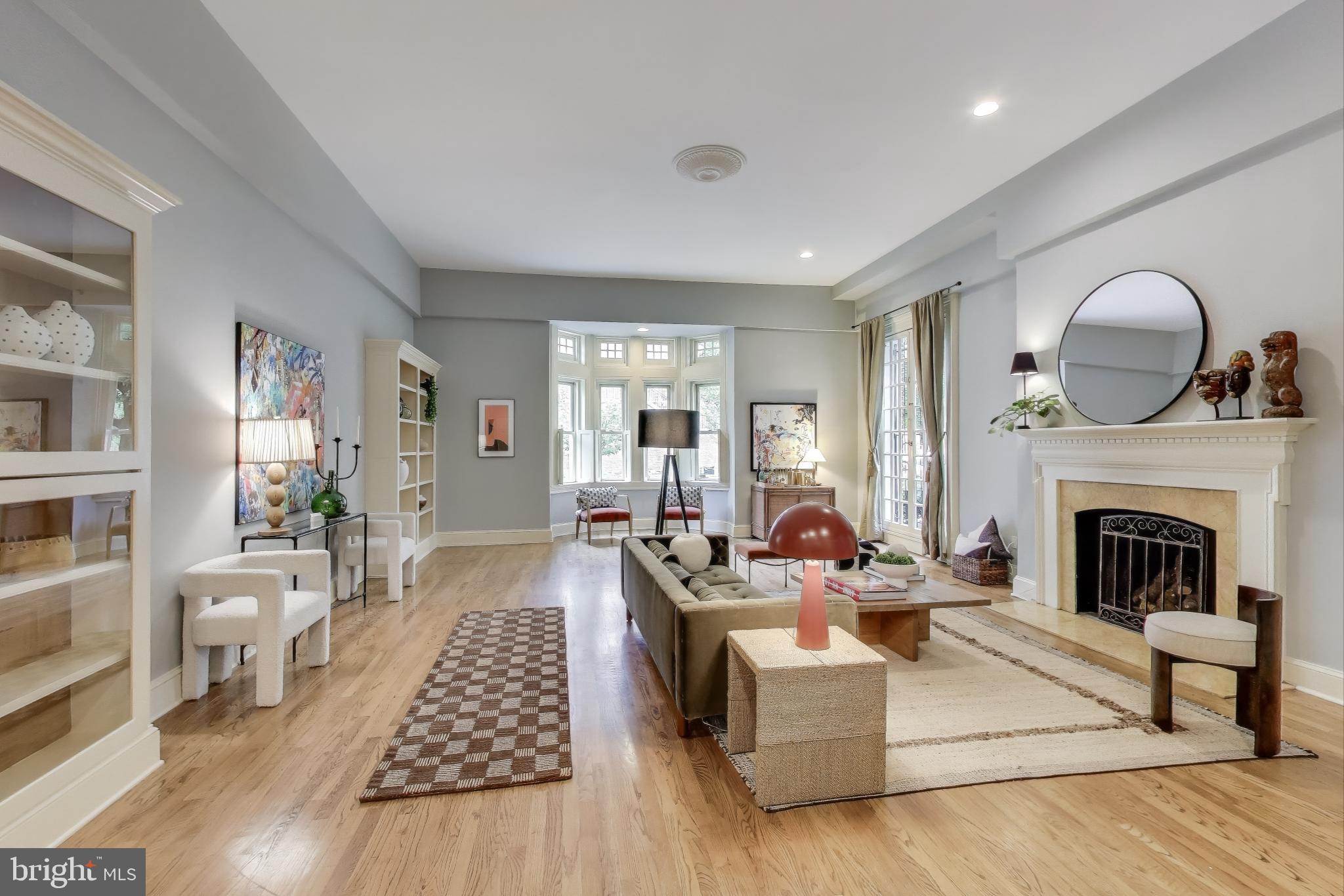 2001 19th Street Northwest, Unit 3 Washington, DC 20009 - Photo 3 of 29 a living room with furniture and a fireplace