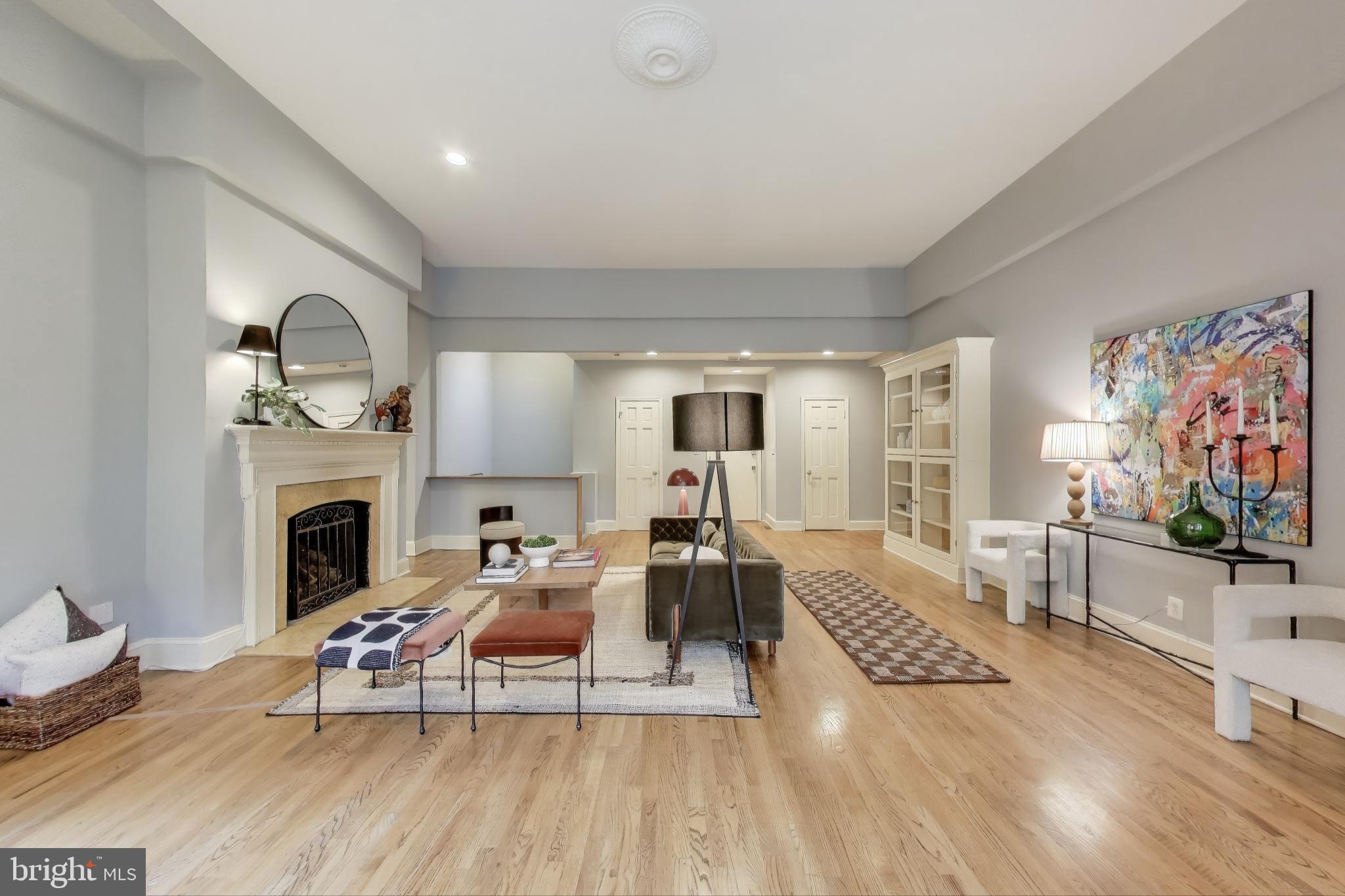 2001 19th Street Northwest, Unit 3 Washington, DC 20009 - Photo 5 of 29 a living room with furniture a fireplace and a flat screen tv