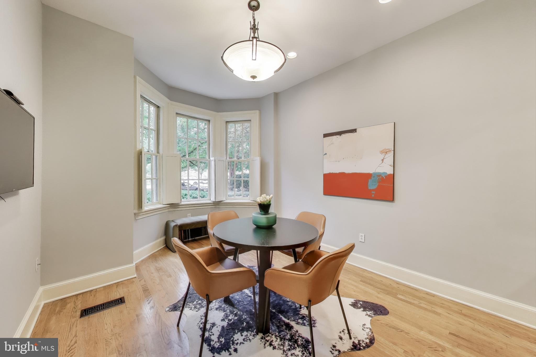 2001 19th Street Northwest, Unit 3 Washington, DC 20009 - Photo 6 of 29 a dining room with furniture and wooden floor