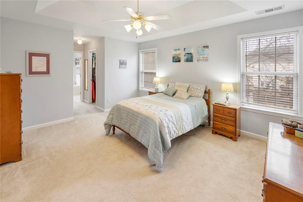 3905 Embassy Way Lilburn, GA 30047 - Photo 11 of 29 a bedroom with a bed dresser and a window