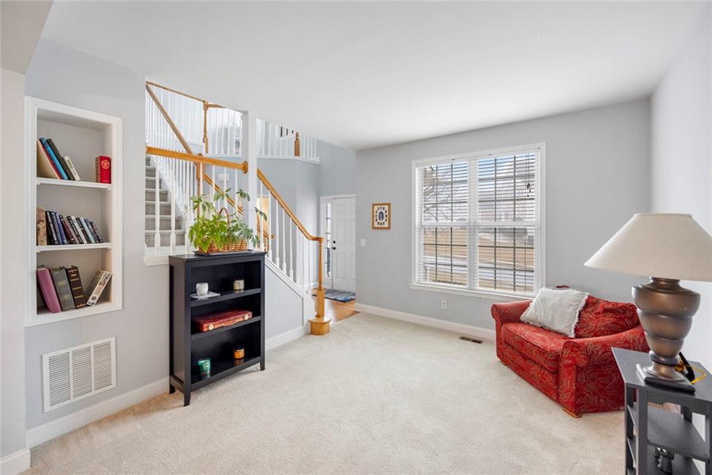 3905 Embassy Way Lilburn, GA 30047 - Photo 2 of 29 a bedroom with furniture and a window