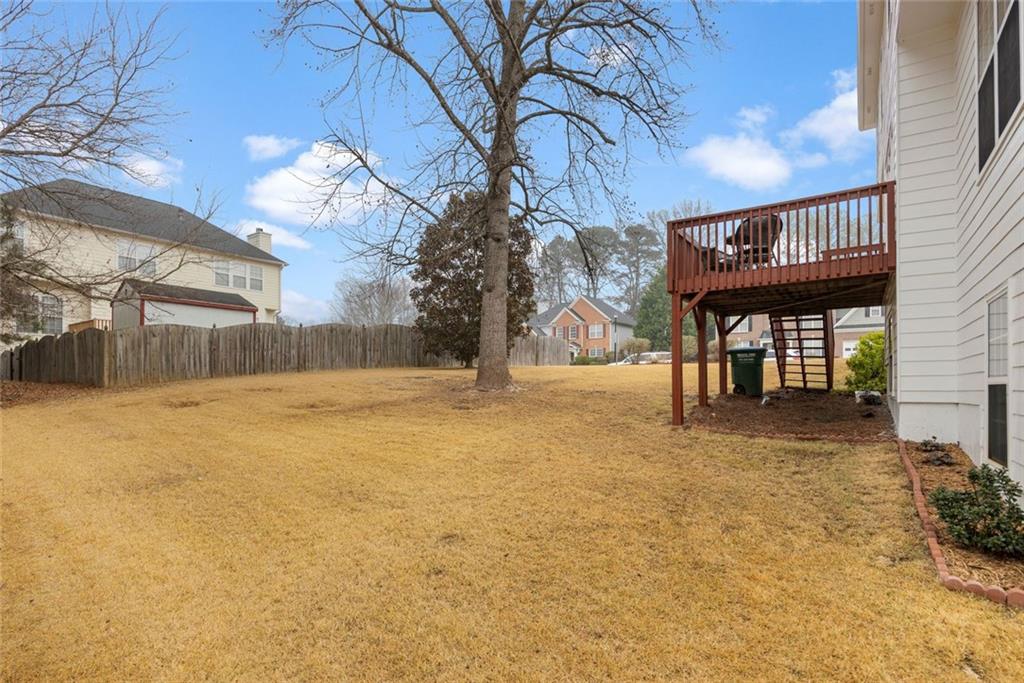 3905 Embassy Way Lilburn, GA 30047 - Photo 26 of 29 a view of a house with a yard