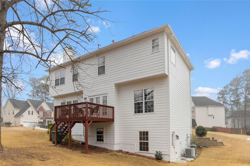 3905 Embassy Way Lilburn, GA 30047 - Photo 27 of 29 a view of a house with a yard