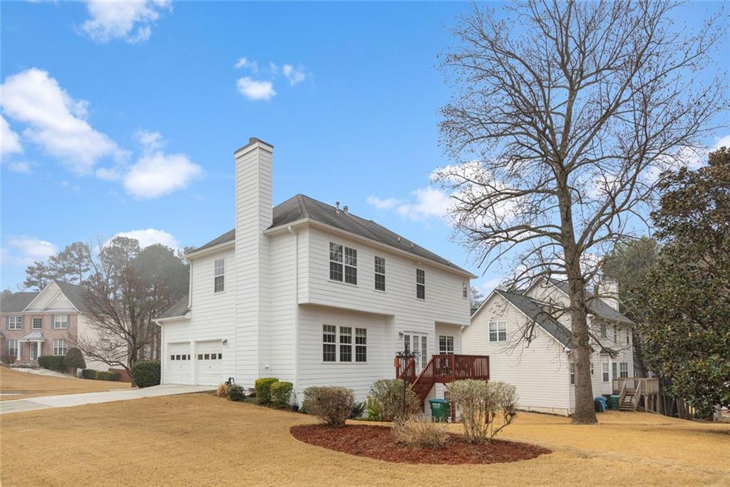 3905 Embassy Way Lilburn, GA 30047 - Photo 28 of 29 a front view of a house with a yard