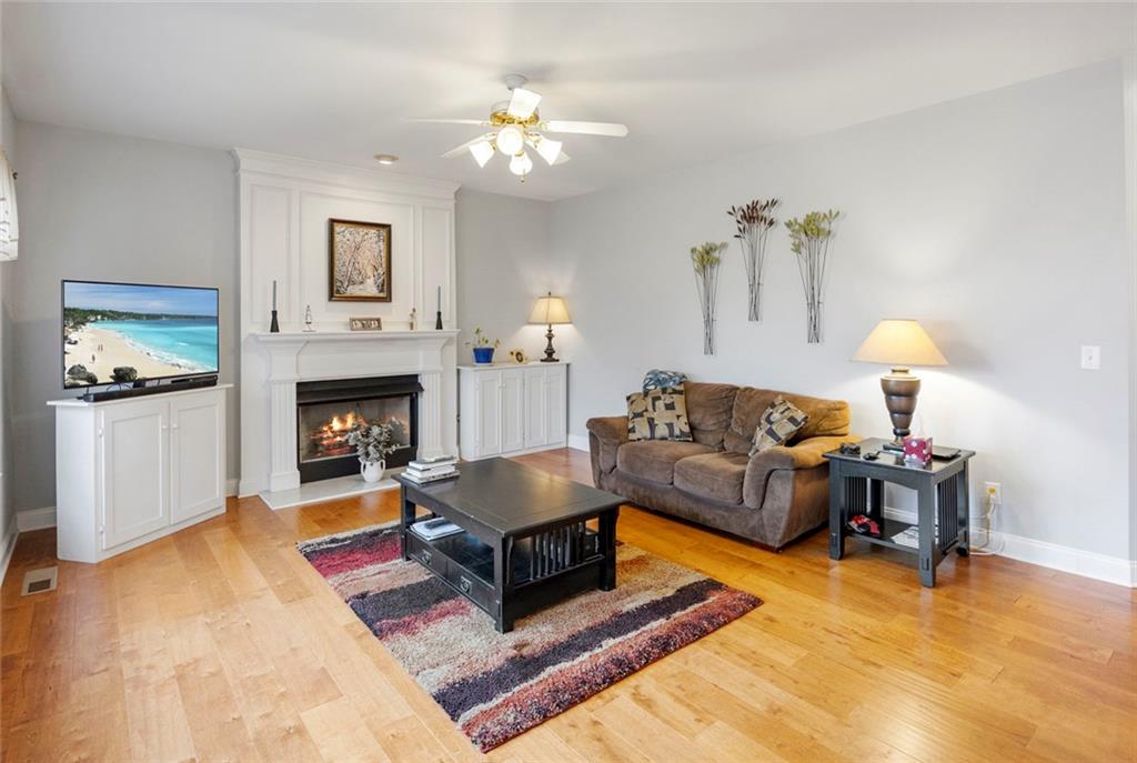 3905 Embassy Way Lilburn, GA 30047 - Photo 3 of 29 a living room with furniture and a fireplace