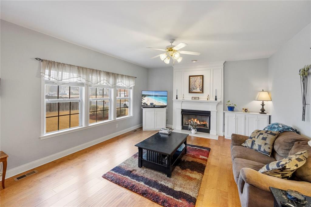 3905 Embassy Way Lilburn, GA 30047 - Photo 4 of 29 a living room with furniture fireplace and window
