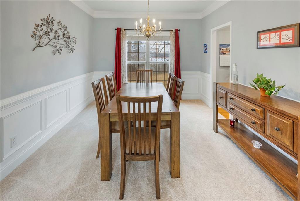 3905 Embassy Way Lilburn, GA 30047 - Photo 5 of 29 a dining room with furniture and window
