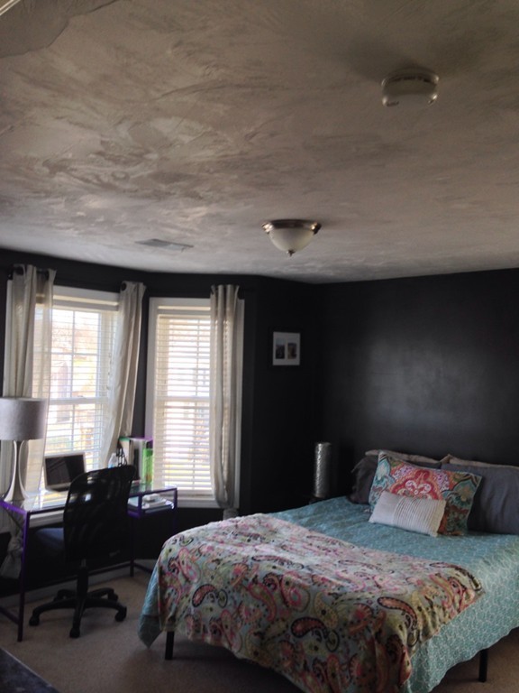 52 Honeysuckle Road Worcester, MA 01607 - Photo 11 of 15 a bedroom with a bed and a window