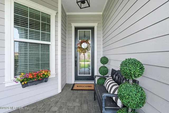 a kitchen with stainless steel appliances kitchen island granite countertop a sink and refrigerator