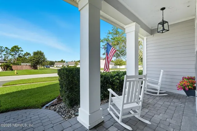 a bed room with a bed and a chandelier