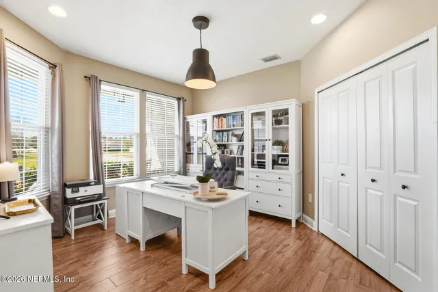 a bathroom with a double vanity sink toilet mirror and shower