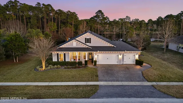 a view of a swimming pool with sitting area