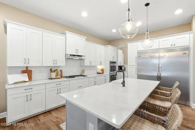 a view of a yard with potted plants