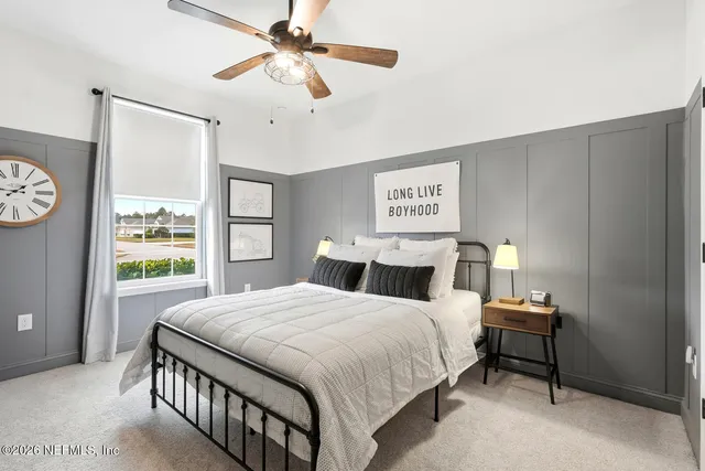 a view of a house with a big yard and potted plants