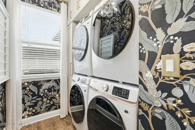 a view of a chairs and table in the backyard