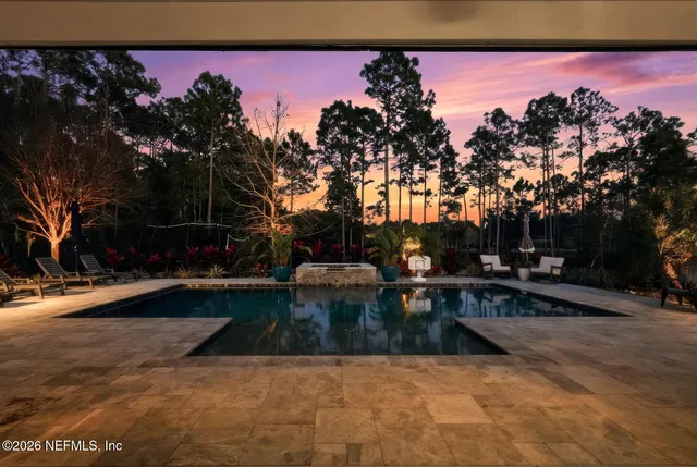 a living room with a couch and a chandelier