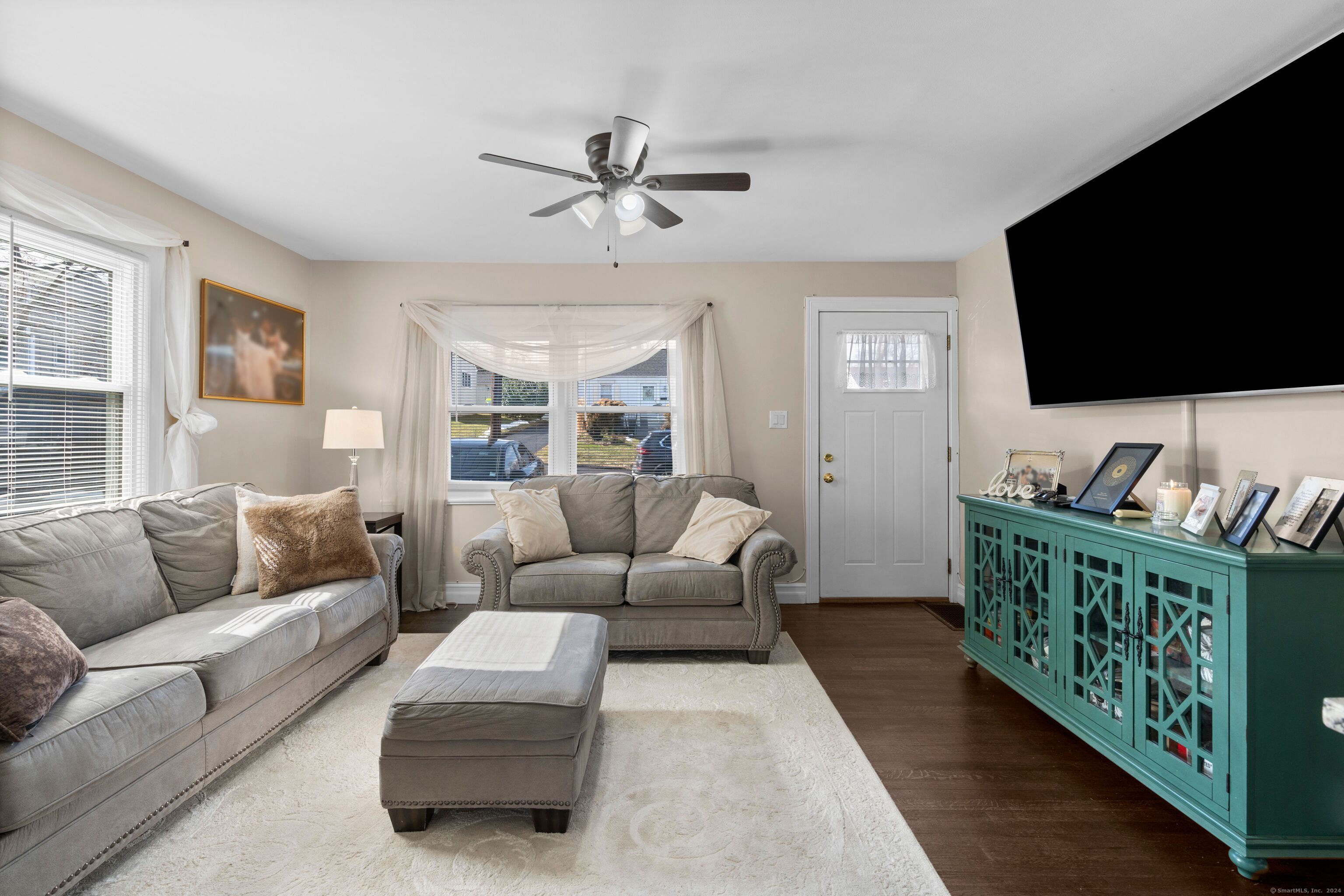27 Strathmore Road West Haven, CT 06516 - Photo 1 of 1 a living room with furniture and a flat screen tv