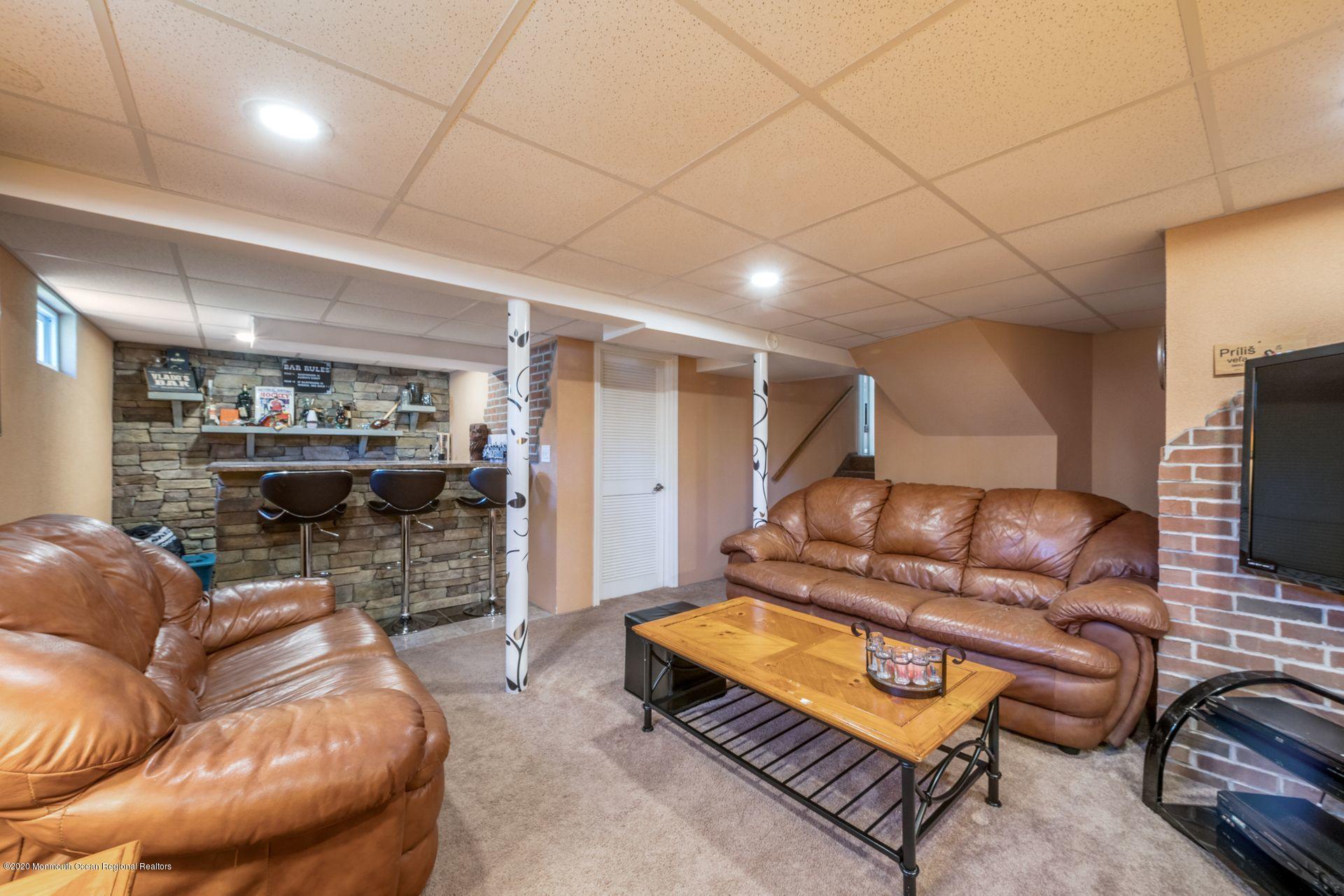 17 Appleman Road Somerset, NJ 08873 - Photo 17 of 20 a living room with furniture and a flat screen tv