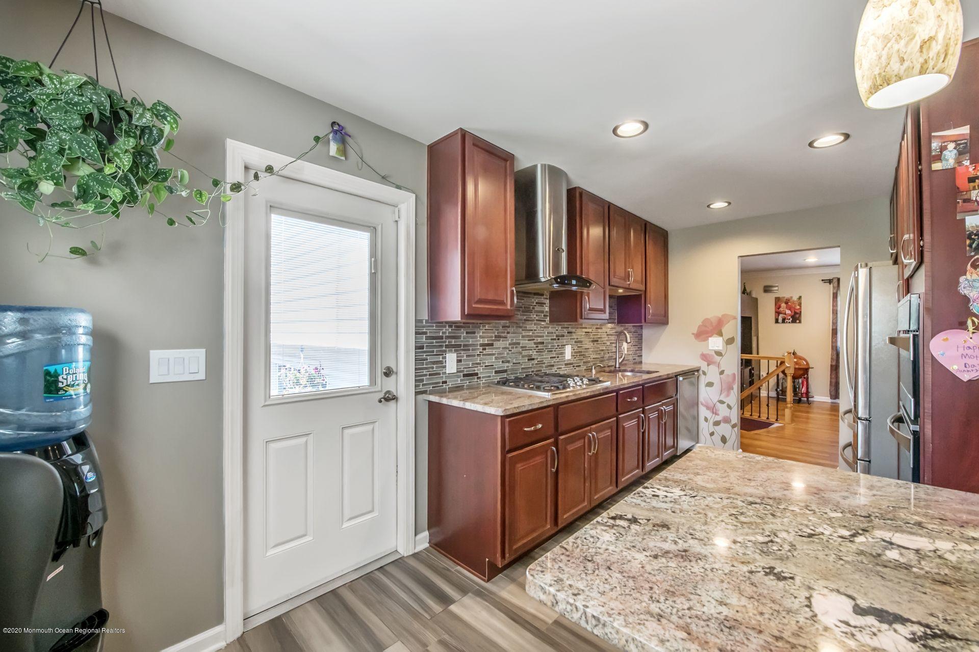 17 Appleman Road Somerset, NJ 08873 - Photo 6 of 20 a kitchen with stainless steel appliances granite countertop a stove and a wooden cabinets