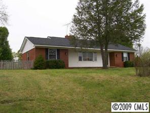 560 State Rd S-13-914 Pageland, SC 29728 - Photo 1 of 6 a front view of a house with a garden