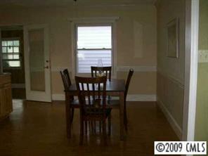 560 State Rd S-13-914 Pageland, SC 29728 - Photo 5 of 6 a view of a dining room with furniture and wooden floor