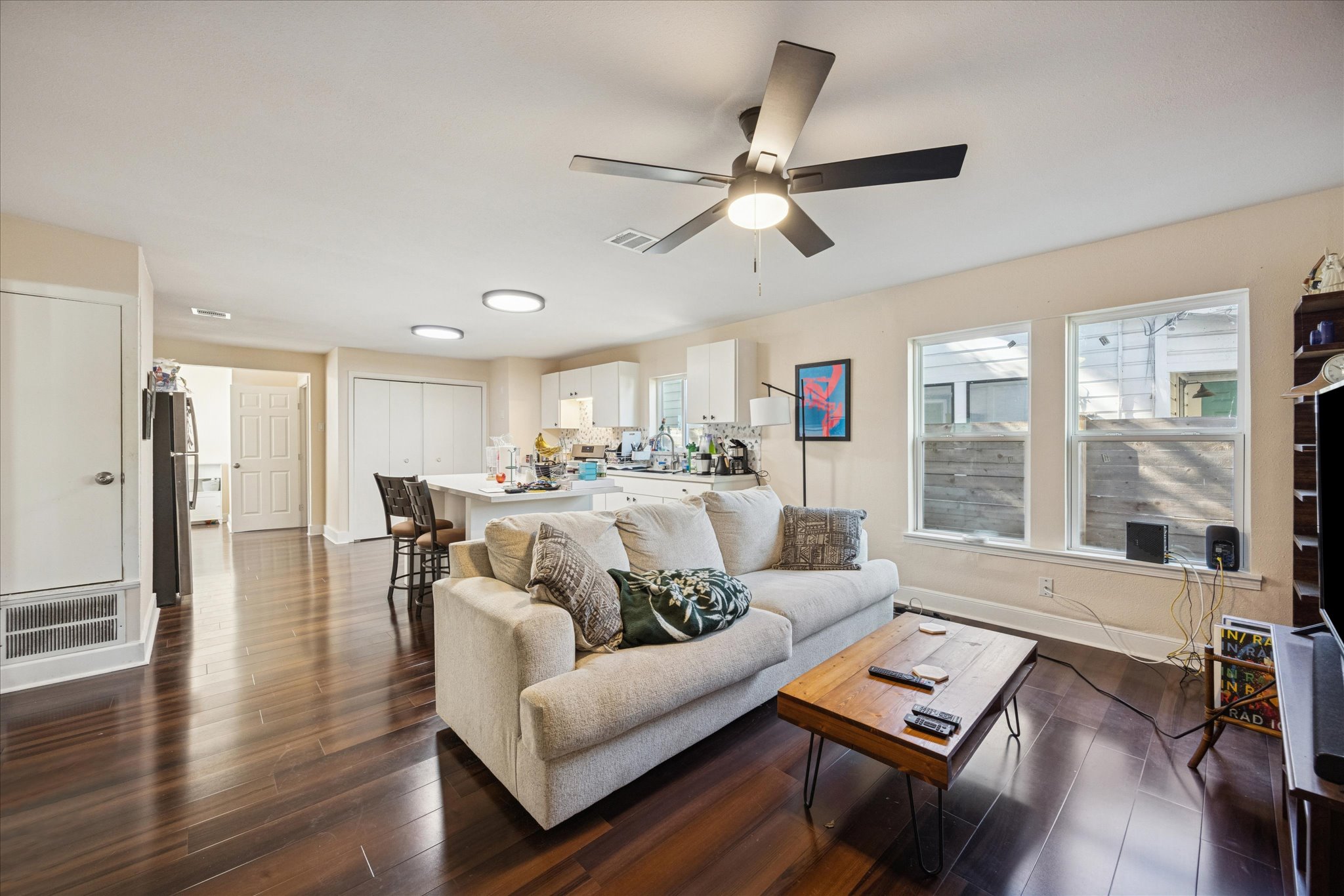 907 East 53rd Street Austin, TX 78751 - Photo 6 of 30 Living area with dark wood-type flooring and a ceiling fan