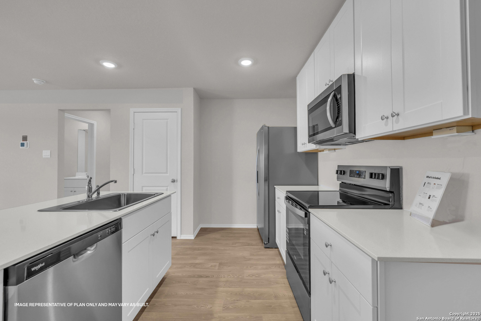 417 Low Pasture Trail Maxwell, TX 78656 - Photo 5 of 34 a kitchen with stainless steel appliances granite countertop a sink and a stove