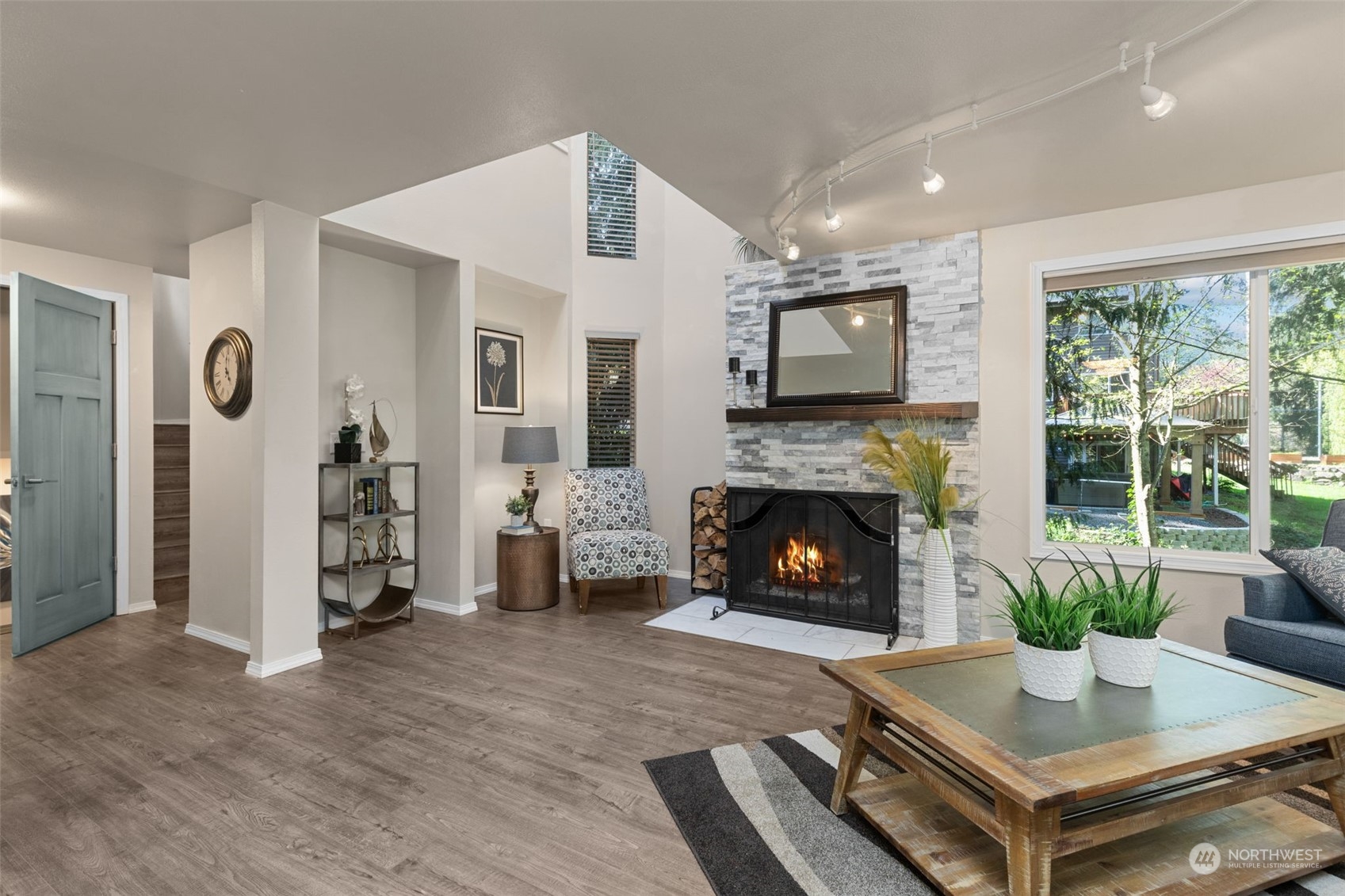 21701 4th Avenue Southeast Bothell, WA 98021 - Photo 5 of 40 a living room with furniture and a fireplace