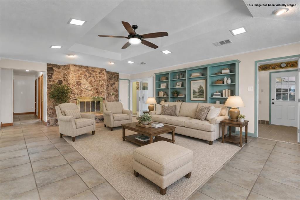 1900 South Duncanville Road Red Oak, TX 75154 - Photo 6 of 39 Virtually staged living room with woodburning fire place and built-ins.