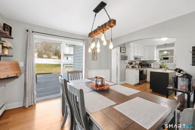 a dining room with furniture and window