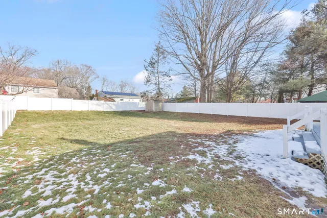 a view of a yard with an ocean