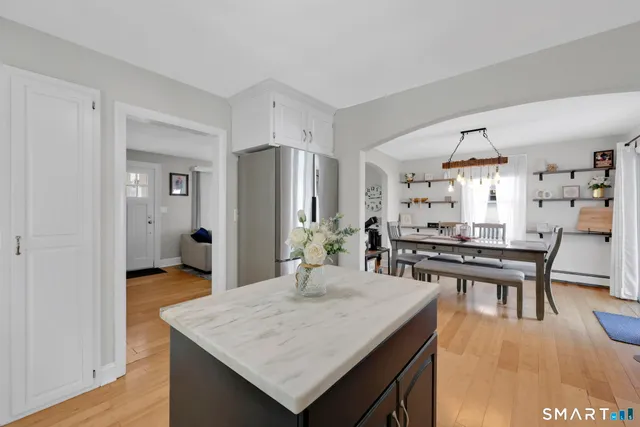 a kitchen with a table and chairs in it