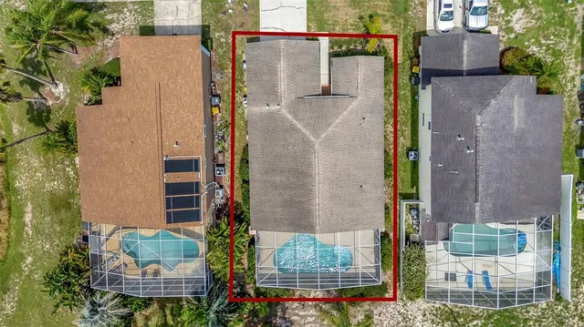 aerial view of a house with a garden