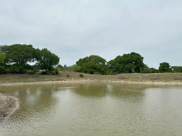 a view of lake with green space