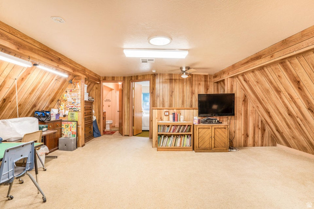 48 South Sage Road Pine Valley, UT 84781 - Photo 32 of 61 Expansive room featuring wood-paneled walls and ceiling, wall-to-wall carpeting, and multiple doorways