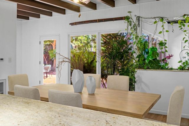 a bathroom with a granite countertop sink mirror and shower